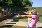 Students line up and practice shooting at close range.